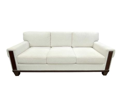 Superyacht furnishings, a contemporary three/four seater sofa with white boucle fabric.  On a highly laquered wood veneered b