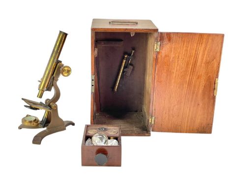 A late Victorian brass and lacquered microscope. Contained in a mahogany case, height 34cm.