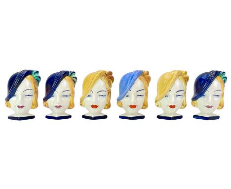 Six Beswick Art Deco mask head ceramic napkin rings. Each handpainted, height 8cm.No apparent damage, light crazing, one is s