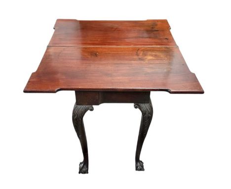 A George III mahogany fold-top tea table. The swivel top was originally supported by a gate leg action but now with a convert