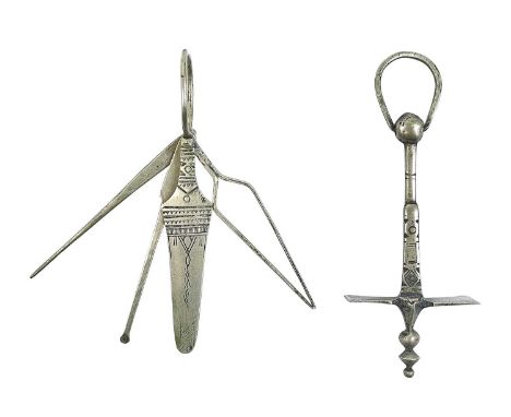 A Tuareg metal sugar hammer. Early 20th century, with engraved decoration, length 8.5cm, together with four similar tools, on