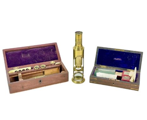 A late Victorian barrel microscope. Height 20cm, contained in a mahogany case with bone slides, lenses, etc, together with a 