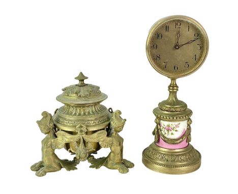 A French gilt bronze inkwell. 19th century, with a hinged lid, supported by three winged female sphinx figures, height 14cm, 