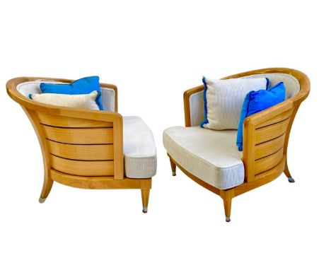 Superyacht furnishings, a pair of upholstered chairs with curved backs.  Laquered light wood veneer with white upholstered se