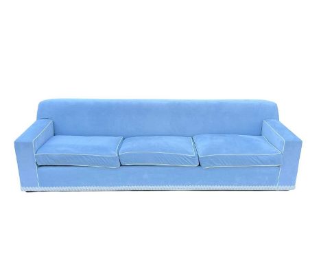 Superyacht furnishings, a contemporary blue velour four/five seater sofa.  Featuring a curved back on a black base, white pip