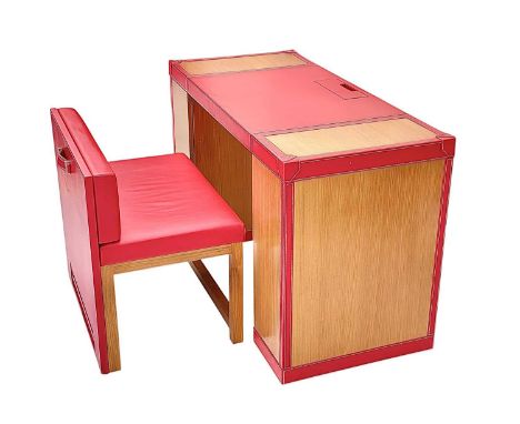 Superyacht furnishings, a red leather space-saving desk with a matching upholstered chair.  A contemporary design of colourfu
