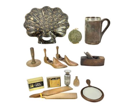 A leather tankard with a sterling silver shield and mount. Height 18cm, with various item of treen including a plane, shoe la