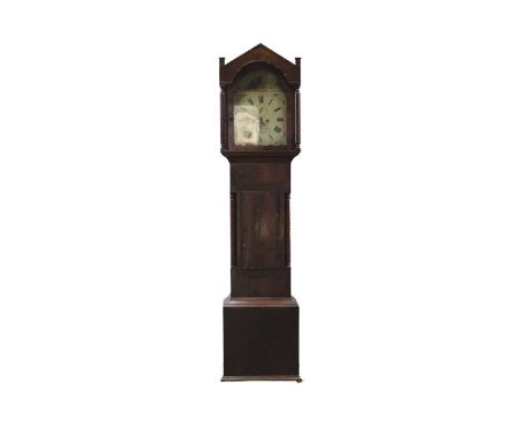 An eight day mahogany longcase clock by S Shortman, Penzance. 19th century, with a white painted arched dial, the crossbanded