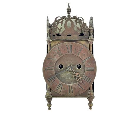A Victorian brass lantern clock. With a twin fusee movement, the dial inscribed 'J Howard Londini Fecit 1695, engraved with a