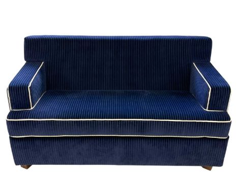 Superyacht furnishings, a contemporary two-seater blue sofa.  Upholstered in a chunky retro navy blue cord fabric with contra