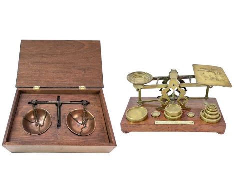 A set Victorian of S. Mordan & Co brass and walnut postal scales. The brass weights fitted to four recesses in the base, widt