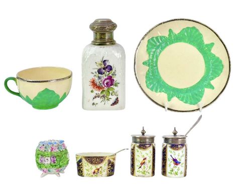 A Berlin porcelain tea caddy. 19th century, with floral painted panels and a later silver cover, height 14cm, and other ceram