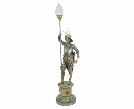 A substantial bronze cavalier floor lamp. French, circa 1910, the lamp with an opaque flame glass shade, the figure standing 