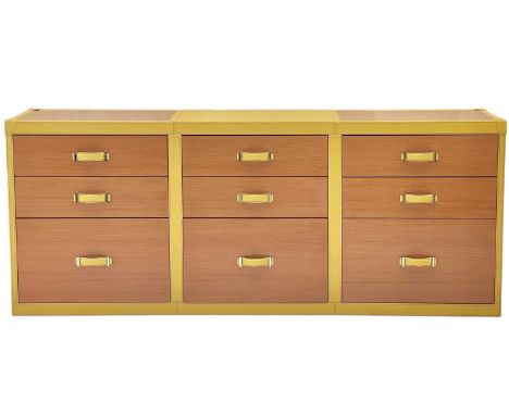 Superyacht furnishings, a yellow leather bank of nine-drawers.  Wood veneer fronts, two small drawers above a deep drawer, wi