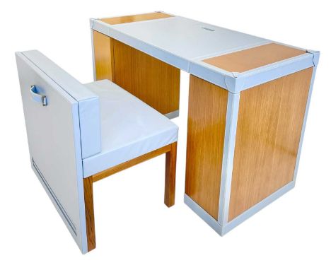 Superyacht furnishings, a baby blue leather space-saving desk with a matching upholstered chair.  A contemporary design of co