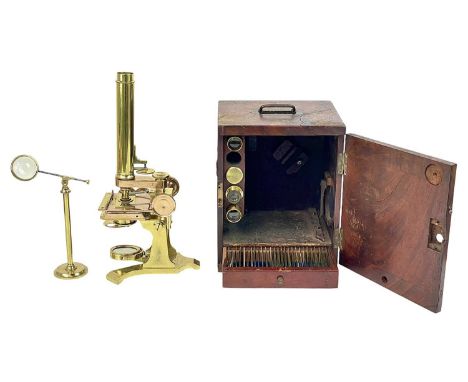 A Victorian brass compound microscope by John Browning. Circa 1870, in a mahogany case with additional eyepieces, and lenses,