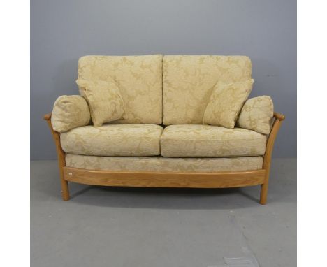 ERCOL - A Renaissance two seater sofa. Overall width 153cm, height 100cm, depth 92cm.
