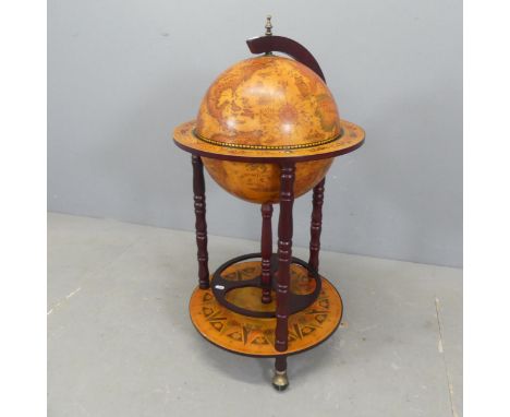 A reproduction globe-design drinks cabinet. Diameter 45cm, height 92cm.