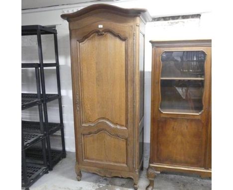 A French oak single door armoire with shelf fitted interior. 90x194x53cm.Internal dimensions: W71cm, H157cm, D42cm.There is n