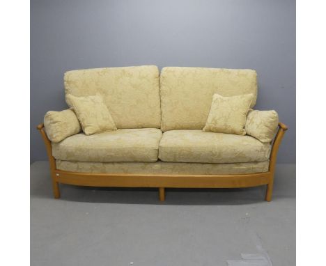 ERCOL - A Renaissance two seater sofa. Overall width 192cm, height 100cm, depth 92cm.
