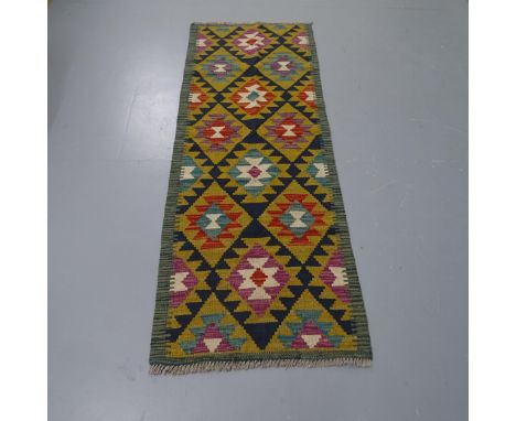 A green ground Maimana Kilim runner, 180 x 66cm