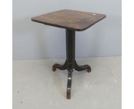 An early 20th century square oak side table on tripod base. Width 46cm, height 70cm.