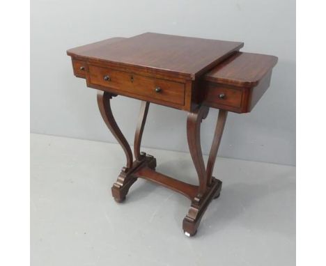 A 19th century Regency mahogany and ebony inlaid ladies’ writing table with adjustable top and three drawers on harp shaped s