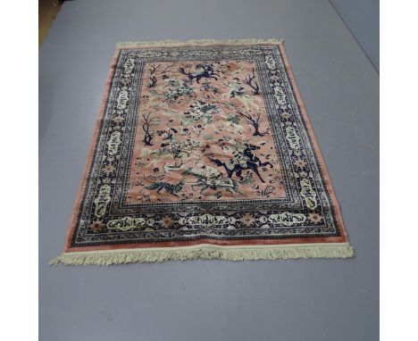 An Indian silk rug, with a central hunting scene depicting a Lion and Tiger, 172 x 1265.5cm