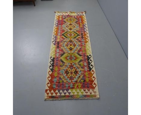 A Chobi Kilim runner, wool, 197cm x 67cm.