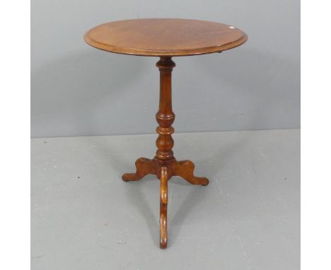 An antique mahogany circular topped occasional table, raised on turned central column with tripod base. Diameter 51cm, height
