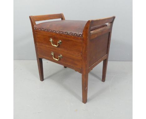 A Georgian style mahogany and studded leather upholstered piano stool, the 2 fall-fronted drawers containing some vintage she