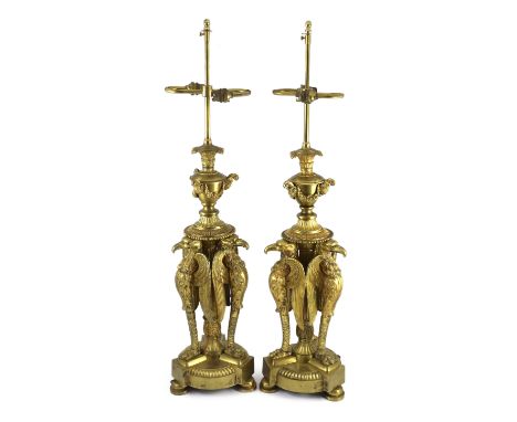 A pair of Empire Revival ormolu table lamps, modelled as urns raised upon eagle monopodia, overall 91cm high***CONDITION REPO