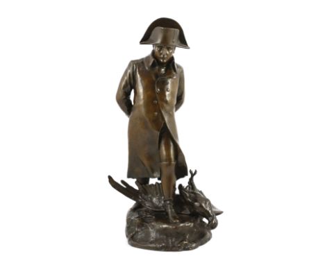 Marius-Jean-Antonin Mercié (French, 1845-1916). A bronze figure of Napoleon déchu, standing wearing a greatcoat, a fallen eag