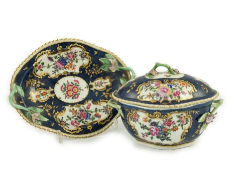 A Worcester scale blue small tureen, cover and stand c.1775, typically painted with floral reserves in gilt cartouches on a s