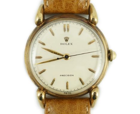 A gentleman's 1950's 9ct gold Rolex Precision manual wind wrist watch, with baton numerals and flared lugs, case diameter 33m