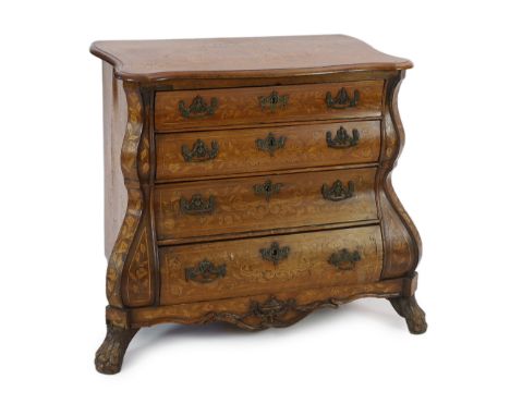 An early 19th century Dutch walnut and marquetry bombé front commode, with serpentine top and four long drawers, on lions paw