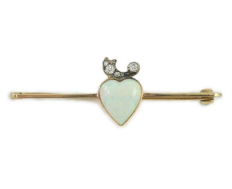 An early 20th century gold, heart shaped white opal and six stone diamond set bar brooch, 51mm, gross weight 2.6 grams.***CON