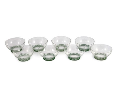 A set of eight R. Lalique Dampierre pattern bowls, model no. 3136,  designed 1932, each moulded with a blue stained band of b