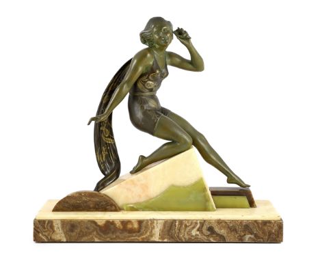 A French Art Deco bronzed spelter and marble figure of a bathing beauty, kneeling with a seashell held to her ear, on stepped