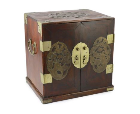 A Chinese brass mounted huanghuali and hardwood seal cabinet, Qing dynasty, applied with later pierced brass cartouches to th