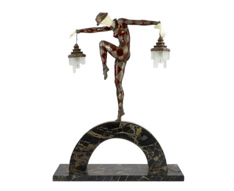 After Marcel Andre Bouraine (French, 1886 -1948).  A French Art Deco bronze and ivory figural lamp, the female dancer standin