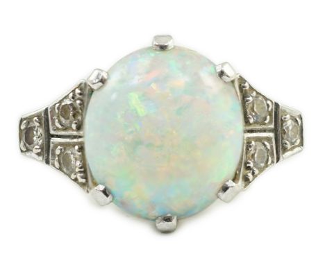 An 18ct white gold, platinum and single stone white opal set dress ring, with six stone diamond set shoulders, size G, gross 