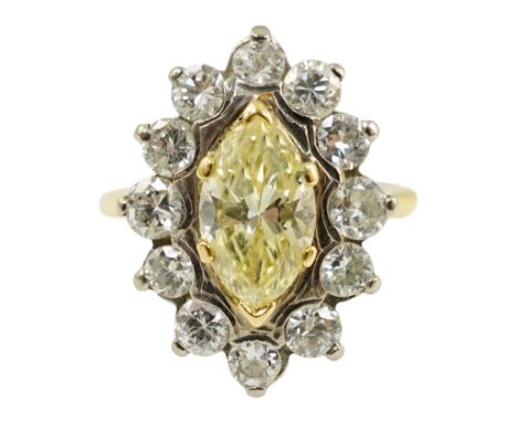 An 18ct gold and single stone fancy yellow diamond set marquise shaped cluster ring with round brilliant cut diamond set bord