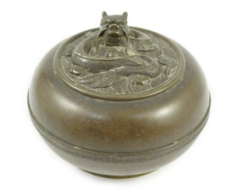 A Chinese bronze 'dragon' circular incense box and cover, Xuande seal mark, 18th/19th century, the cover cast and chased in r