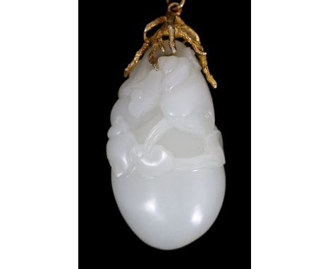 A Chinese white jade ‘conch shell’ yellow metal mounted pendant, the pendant carved with a large conch shell, smaller shells 