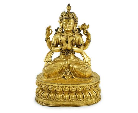 A Sino-Tibetan gilt bronze figure of Shadakshari Lokeshvara, possibly 18th century, seated in vajraparyankasana on a double l