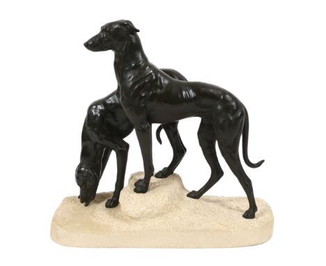 Jules Edmund Masson (French, 1871-1932). A French Art Deco bronze group of two hounds, on naturalistic plinth, with inset pla