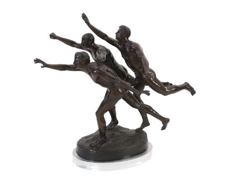 After Alfred Boucher (French, 1850-1934). A large bronze group of three runners at the finishing line, 'Au But', on integral 