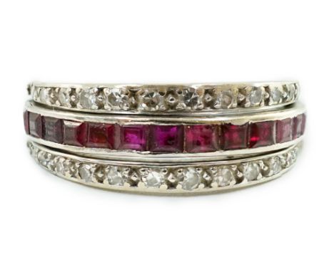 A mid 20th century white gold, diamond, ruby and sapphire set swivelling triple band eternity ring, size L, gross weight 4.8 