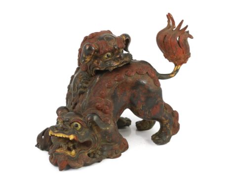 A large Japanese gilt and red lacquered bronze ‘shi-shi’ koro and cover, Edo period, boldly modelled with two shi-shi playing